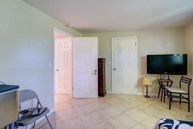 tiled bedroom with baseboards