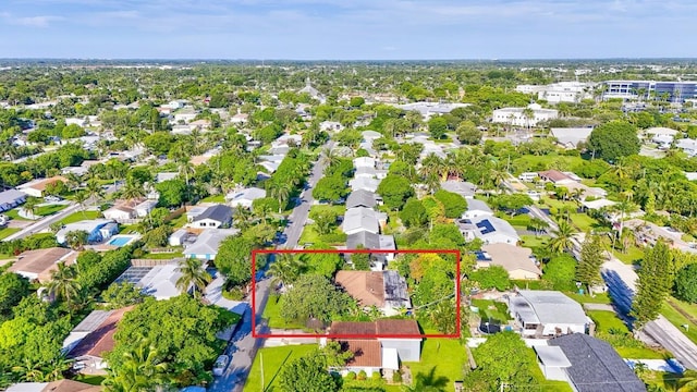 birds eye view of property with a residential view