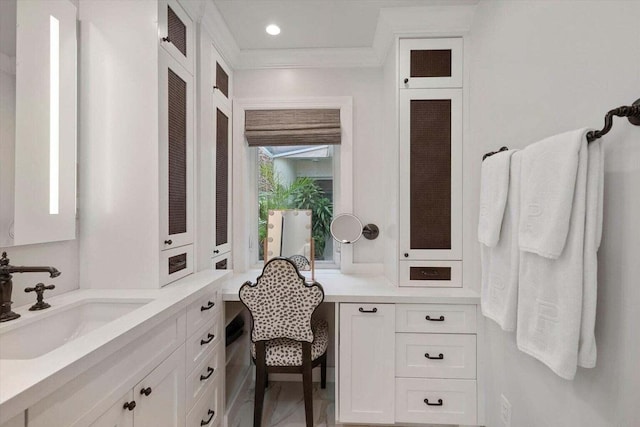 bathroom with vanity and crown molding