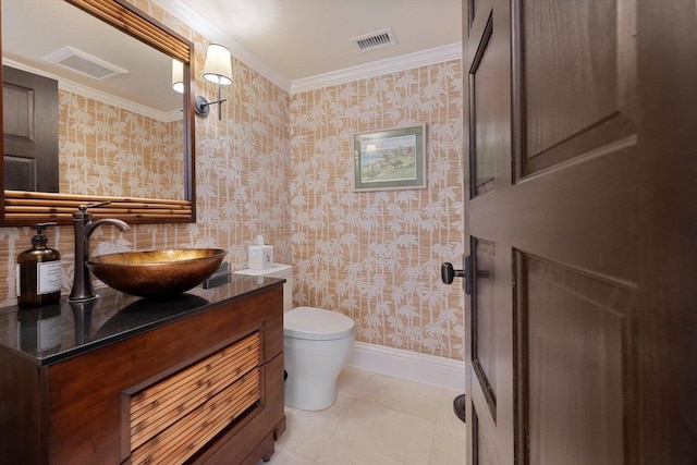 bathroom with toilet, ornamental molding, tile patterned floors, and vanity