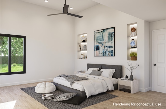 bedroom featuring lofted ceiling, ceiling fan, and light wood-type flooring