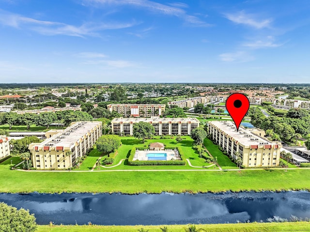 birds eye view of property with a water view