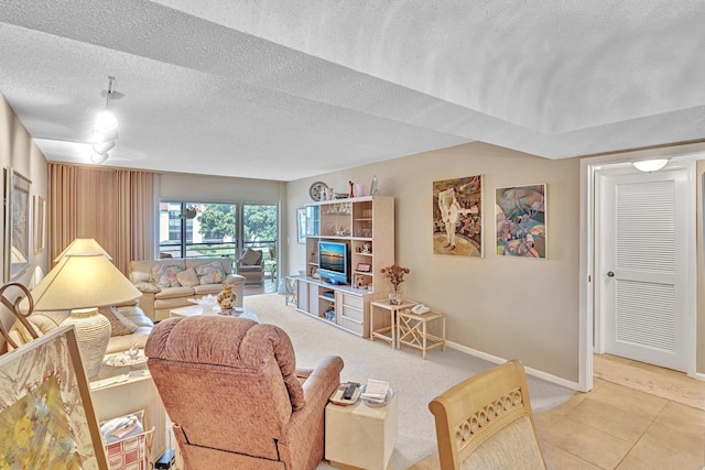 living room featuring a textured ceiling and tile patterned floors