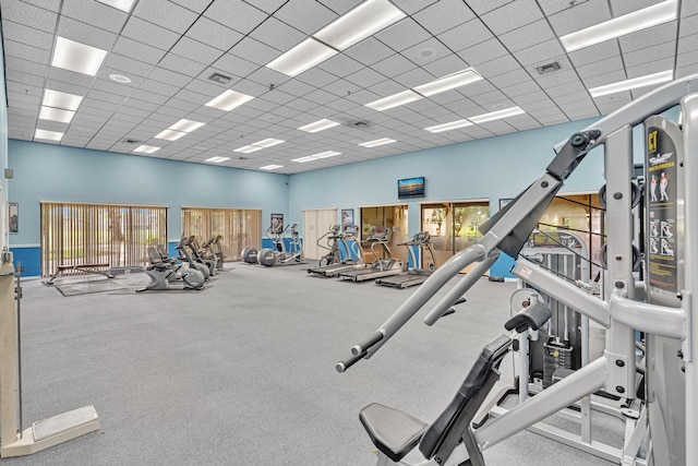 exercise room featuring a paneled ceiling