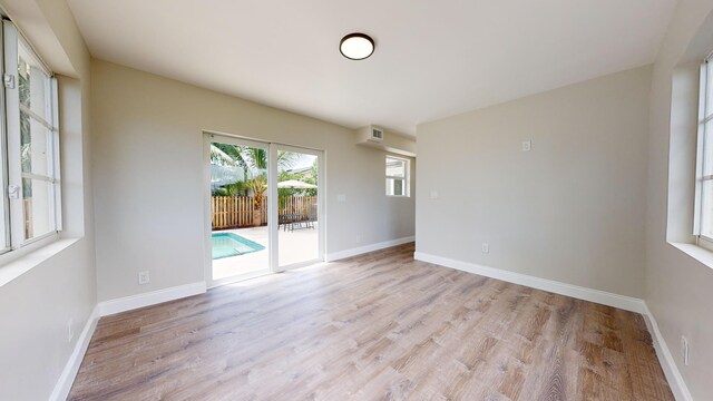 unfurnished room featuring light hardwood / wood-style floors