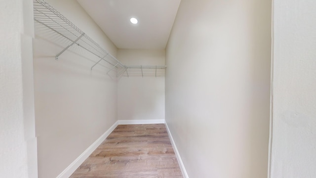 walk in closet featuring light wood-type flooring