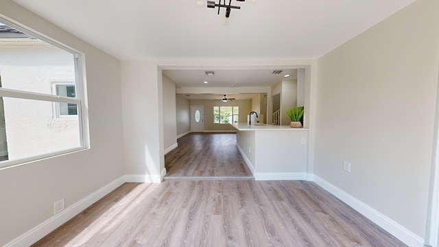 spare room featuring light hardwood / wood-style flooring and sink