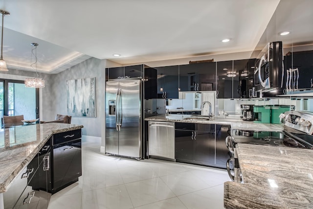 kitchen with light stone counters, pendant lighting, light tile patterned floors, sink, and appliances with stainless steel finishes