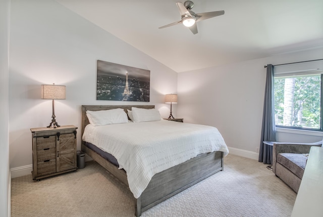 carpeted bedroom featuring lofted ceiling and ceiling fan