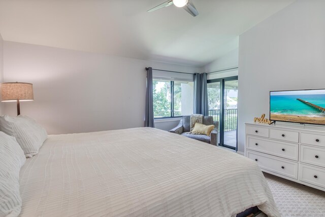 bedroom with ceiling fan, vaulted ceiling, light colored carpet, and access to exterior