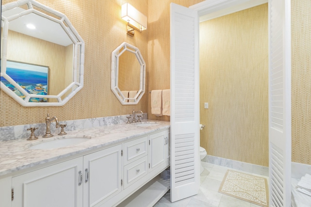 bathroom with vanity and toilet