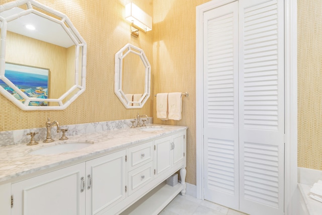 bathroom with tile patterned flooring and vanity