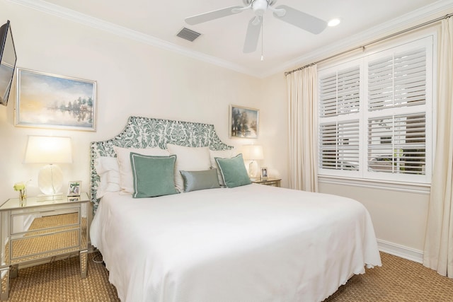 bedroom with ceiling fan, carpet floors, and crown molding