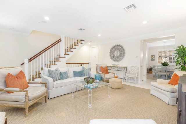 living room featuring ornamental molding and a chandelier