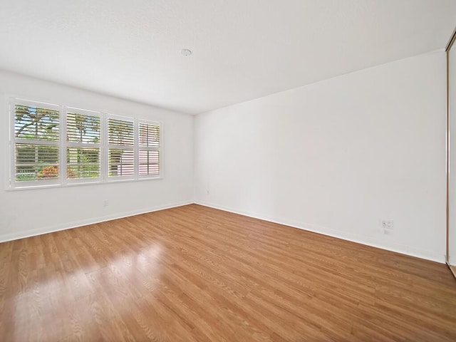 unfurnished room featuring light hardwood / wood-style floors