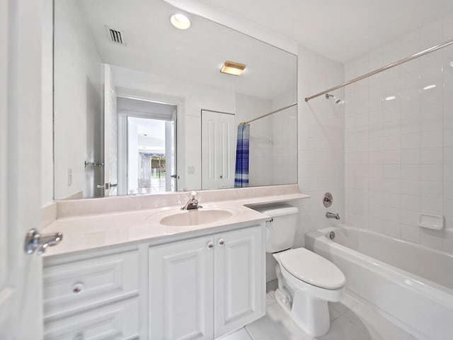 full bathroom with tile patterned flooring, vanity, toilet, and tiled shower / bath