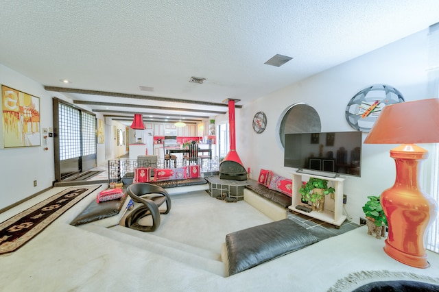 living room featuring carpet and a textured ceiling