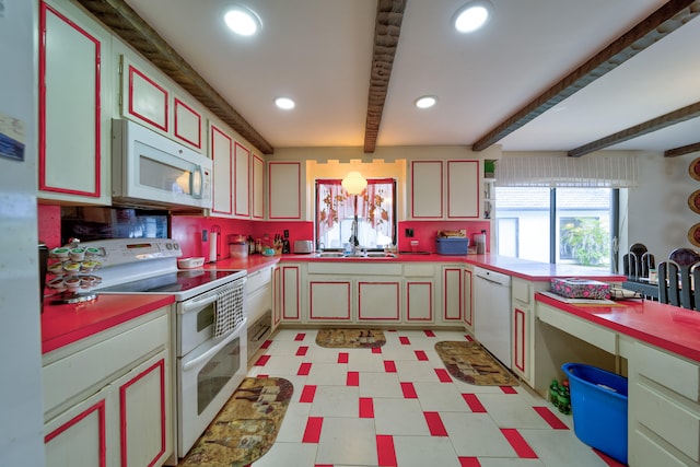 kitchen featuring white appliances, sink, and beamed ceiling