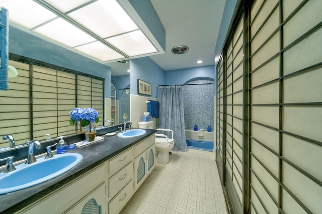 full bathroom featuring tile walls, shower / tub combo with curtain, vanity, and toilet