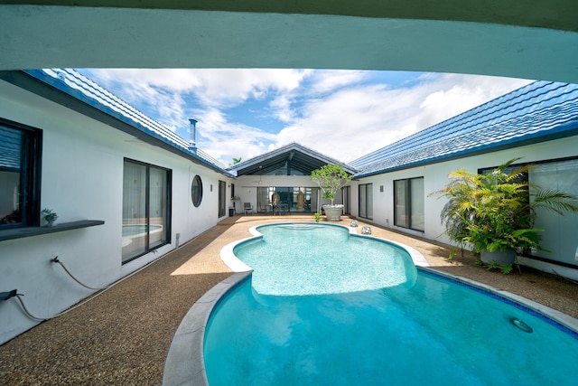 view of pool featuring a patio area