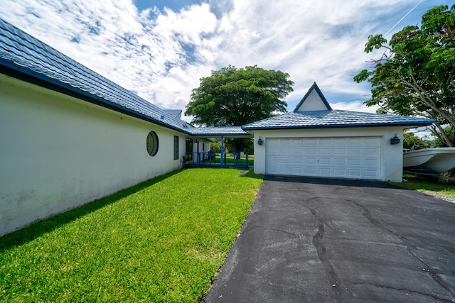 exterior space featuring a front yard and a garage