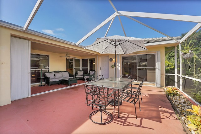 view of patio / terrace with a lanai, an outdoor living space, and ceiling fan