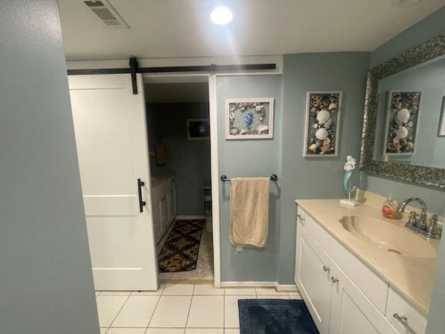 bathroom with vanity, tile patterned flooring, and visible vents