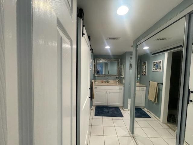 bathroom featuring tile patterned flooring, visible vents, vanity, and recessed lighting