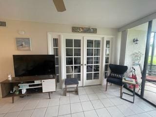 interior space featuring tile patterned flooring, french doors, visible vents, and ceiling fan