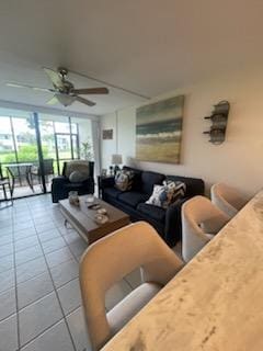 living room with tile patterned flooring and a ceiling fan