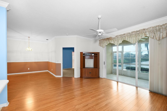 unfurnished room with ornamental molding, ceiling fan with notable chandelier, hardwood / wood-style floors, and a textured ceiling