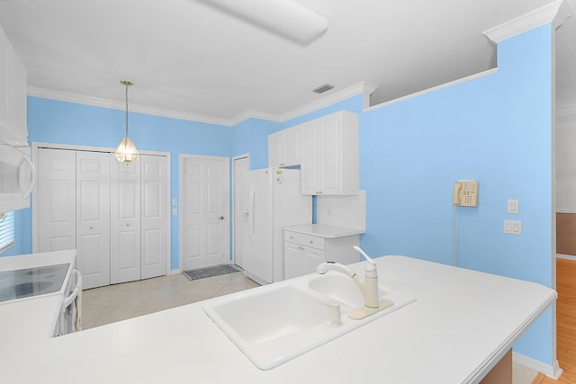 kitchen with sink, white appliances, white cabinetry, hanging light fixtures, and ornamental molding