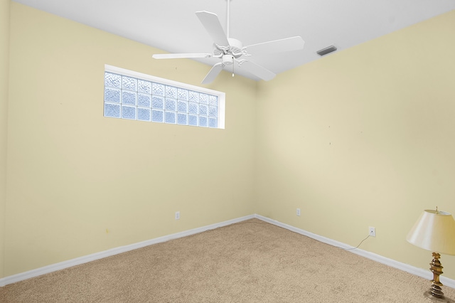 unfurnished room with ceiling fan and light colored carpet