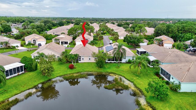 birds eye view of property featuring a water view