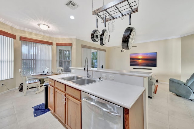 kitchen featuring dishwasher, a kitchen island with sink, a healthy amount of sunlight, and sink