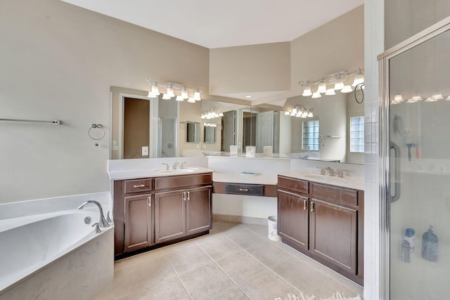 bathroom with separate shower and tub, tile patterned flooring, and vanity