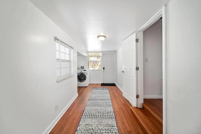 doorway featuring washer / clothes dryer and hardwood / wood-style floors