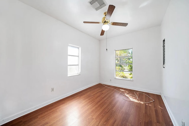 unfurnished room featuring ceiling fan and hardwood / wood-style flooring