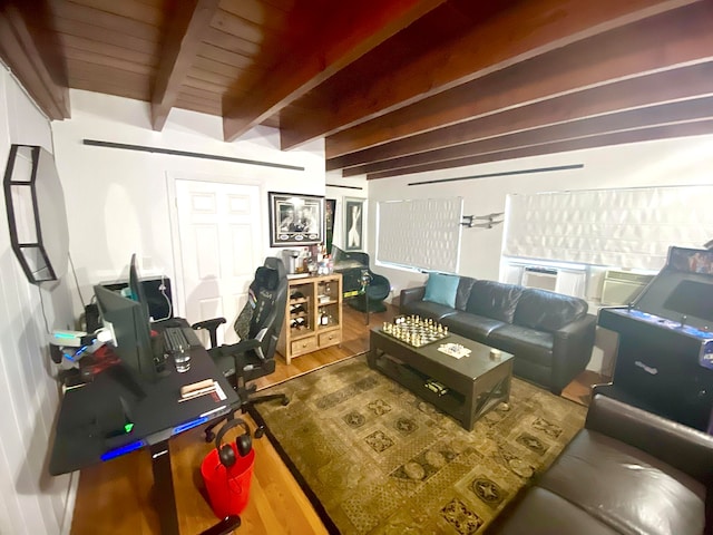 living room featuring beam ceiling and hardwood / wood-style floors