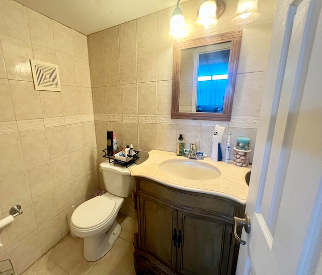 bathroom featuring tile walls, tile patterned flooring, tasteful backsplash, vanity, and toilet