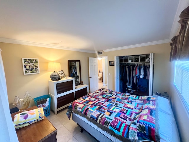 bedroom featuring ornamental molding and a closet