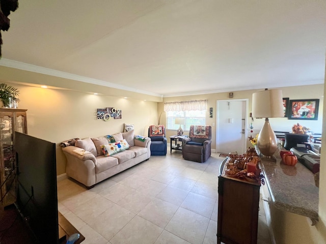 living room featuring ornamental molding and light tile patterned flooring