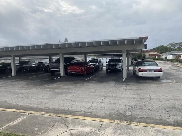 view of vehicle parking featuring a carport