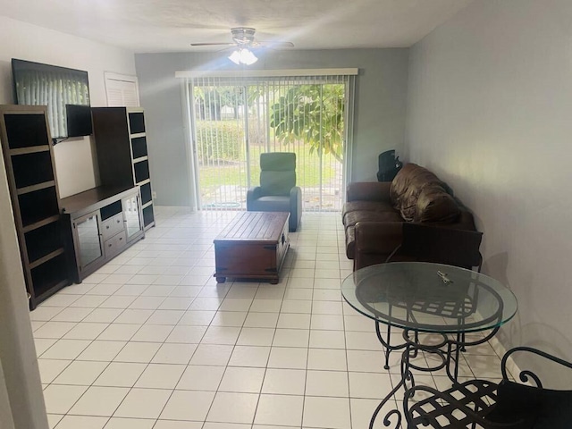 living room with light tile patterned flooring and ceiling fan