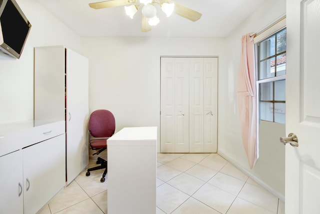 tiled office featuring ceiling fan