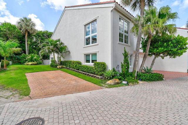 view of home's exterior featuring a lawn