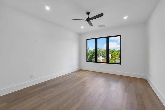 empty room featuring light hardwood / wood-style floors and ceiling fan