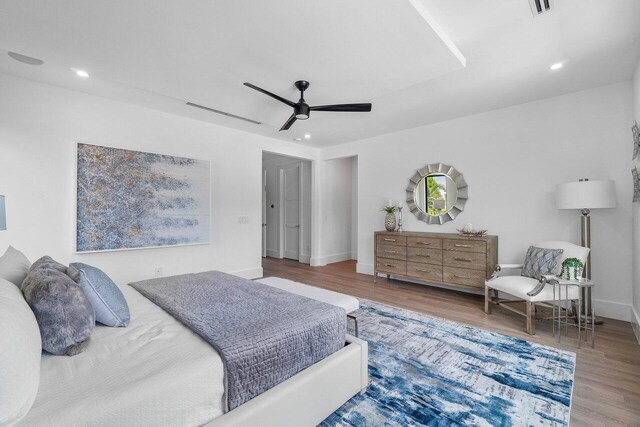 bedroom featuring ceiling fan and hardwood / wood-style flooring