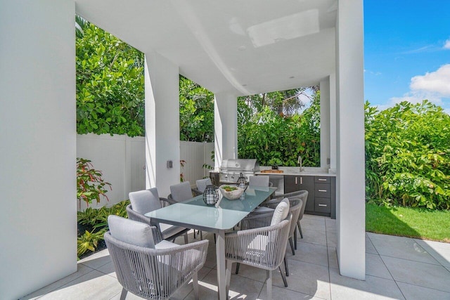 view of patio / terrace with grilling area and sink