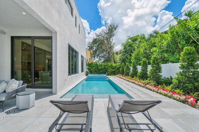 view of swimming pool with a patio area